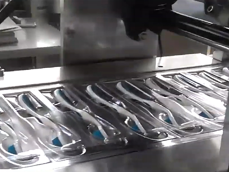 Intelligent blister toothbrush packing machine